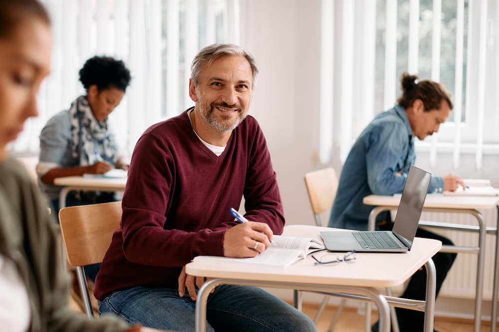 happy mature student learning in the classroom and 2022 10 18 00 53 49 utc.jpg